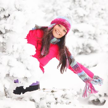 winter girl behind snow tree 