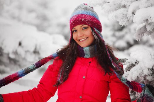 winter girl behind snow tree 