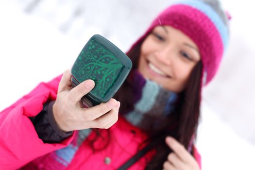 winter woman looking in mirror