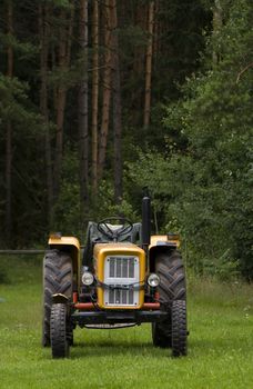 tractor on edge of forest