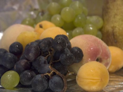 Various fruit the waters covered by drops at usual illumination