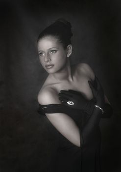 The beautiful girl in a black dress and black gloves