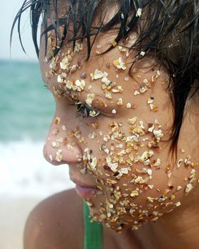 The image of the girl whose face in sand