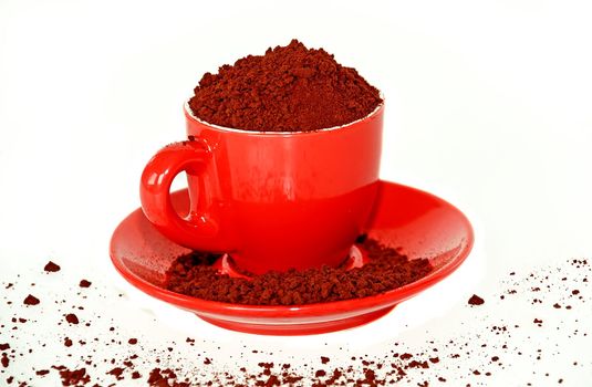 red cup full of coffee granules isolated over white