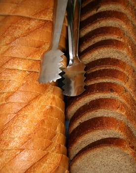 Different kind of bread with a metal nipper