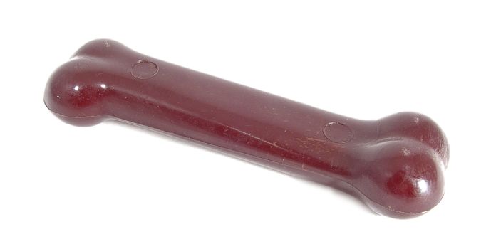 A red dog toy, chewing bone