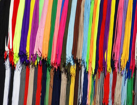 multicolored new laces hanging in row on sale