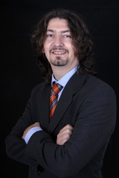 young business man portrait on black background