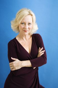 Studio portrait of attractive adult businesswoman looking at viewer.