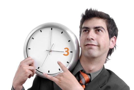 young handsome business man holding a clock