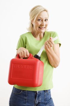 Portrait of smiling adult blonde woman holding gas can.