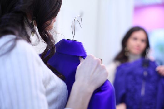 woman in dress room wear dress