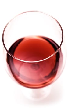 Glass of red wine isolated on a white background.