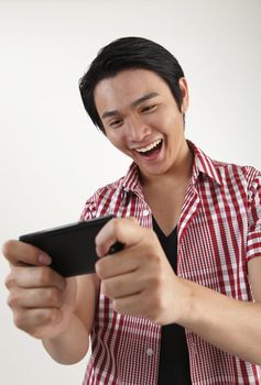 man enjoy playing games on the smartphone