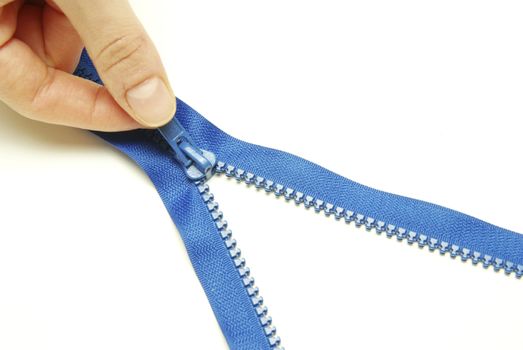 Unzipped blue metal zipper on white background
