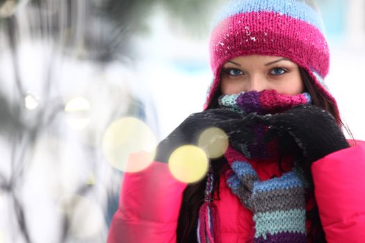 woman in winter hat and holyday bokeh