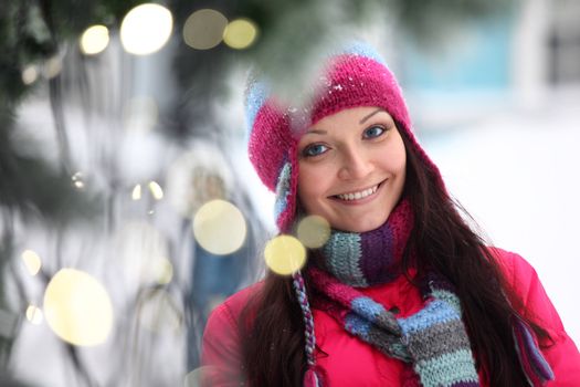 woman in winter hat and holyday bokeh