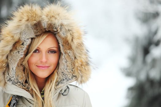 woman in winter hat and holyday bokeh