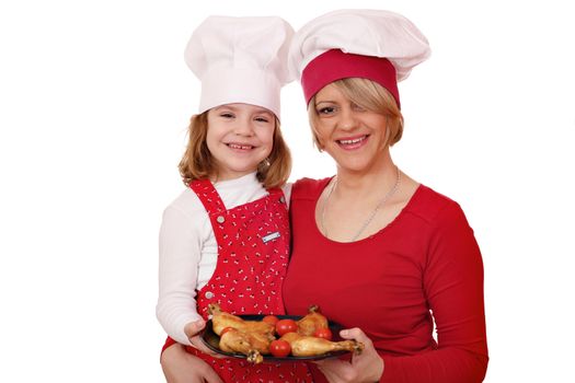 mother and daughter cook with chicken drumstick