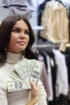 woman in shop look at clothes