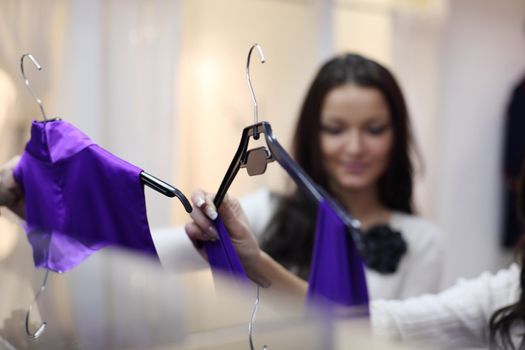 woman in shop look at clothes