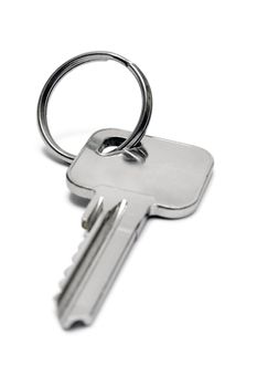 Apartment key isolated on a white background.