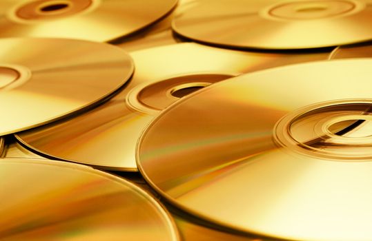 Heap of gold tinted CDs.