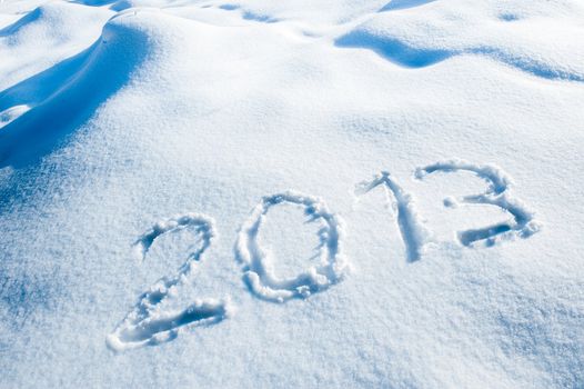 Year 2013 written in a winter landscape