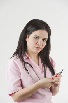 Nurse with stethoscope ready for injection