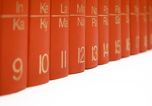 Several red books side by side. Isolated on a white background.