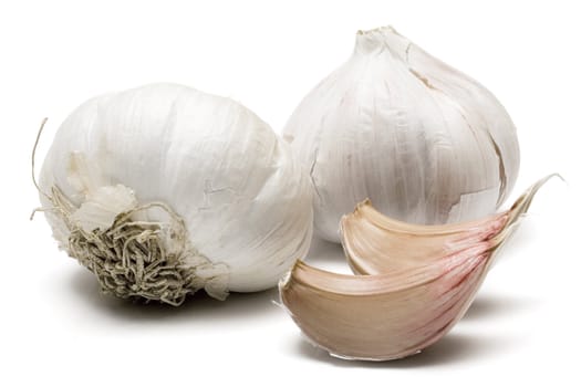 Garlic bulbs and cloves isolated on a white background.