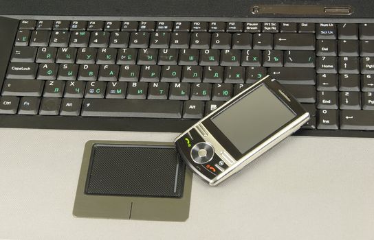 mobile isolated on a laptop