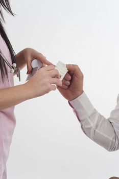 Nurse give pills to patient