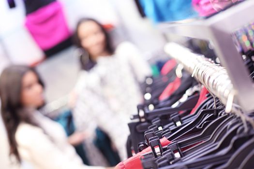 woman in shop look at clothes