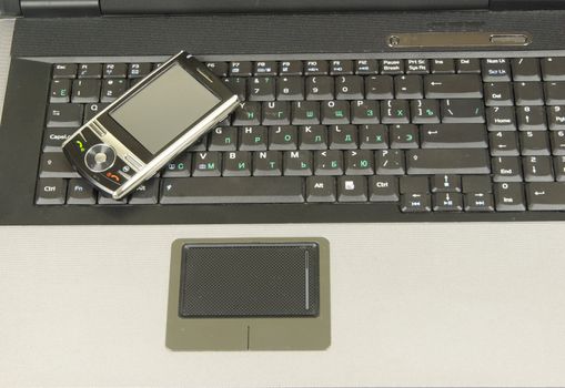 mobile isolated on a laptop