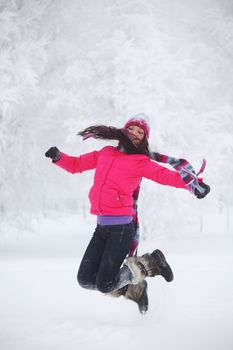 winter women jump in snow