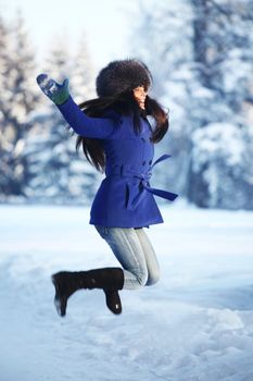 winter women jump in snow