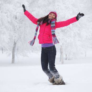 winter women jump in snow