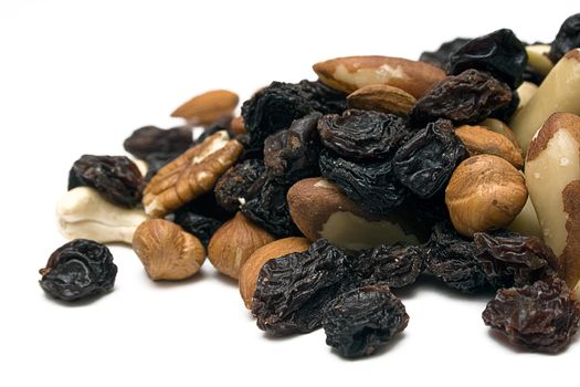 Close-up on nuts and raisins. Isolated on a white background.