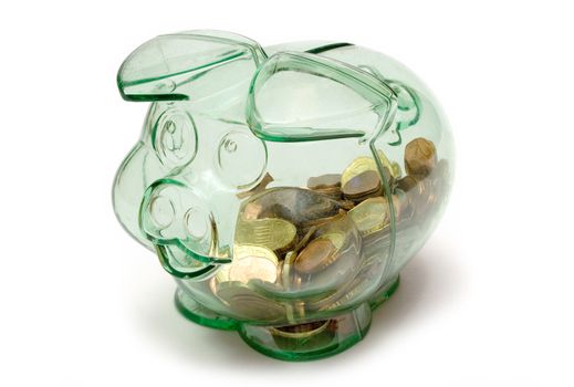 Piggy bank full of coins. Isolated on a white background.