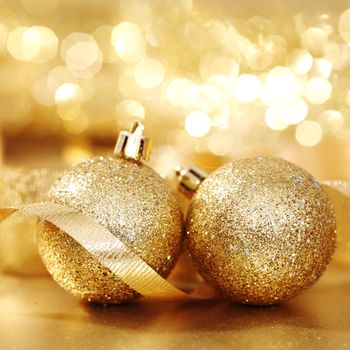 golden christmas ball on golden bokeh background