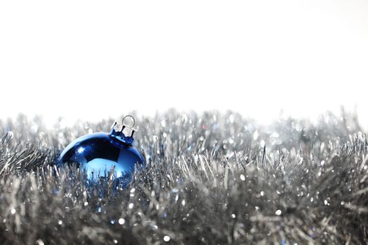 blue christmas ball on silver background
