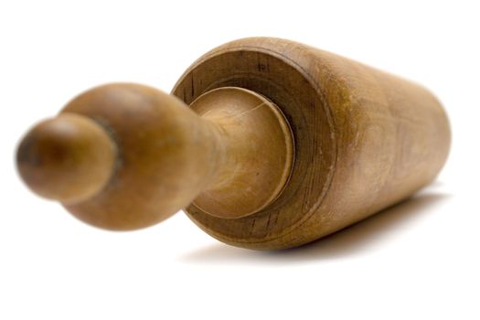Used wooden rolling pin isolated on a white background.