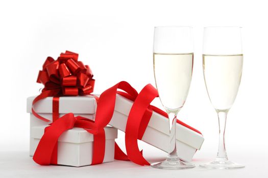 white gift with red ribbon