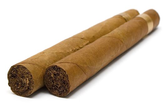 Two cuban cigars isolated on a white background.