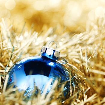  blue christmas ball on golden background