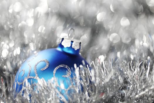 blue christmas ball on silver background