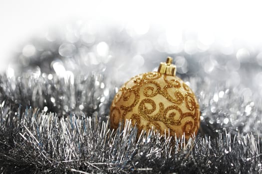  golden christmas ball on silver background