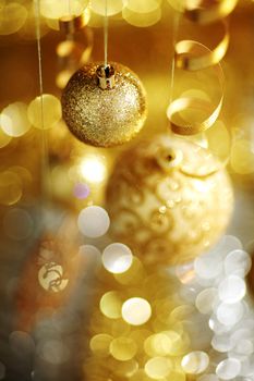 golden christmas balls on bokeh background