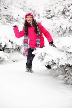 winter woman play snowballs on snow background